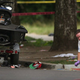 Police investigate a crime scene Saturday where seven people were shot. (Scott Olson/Getty Images)